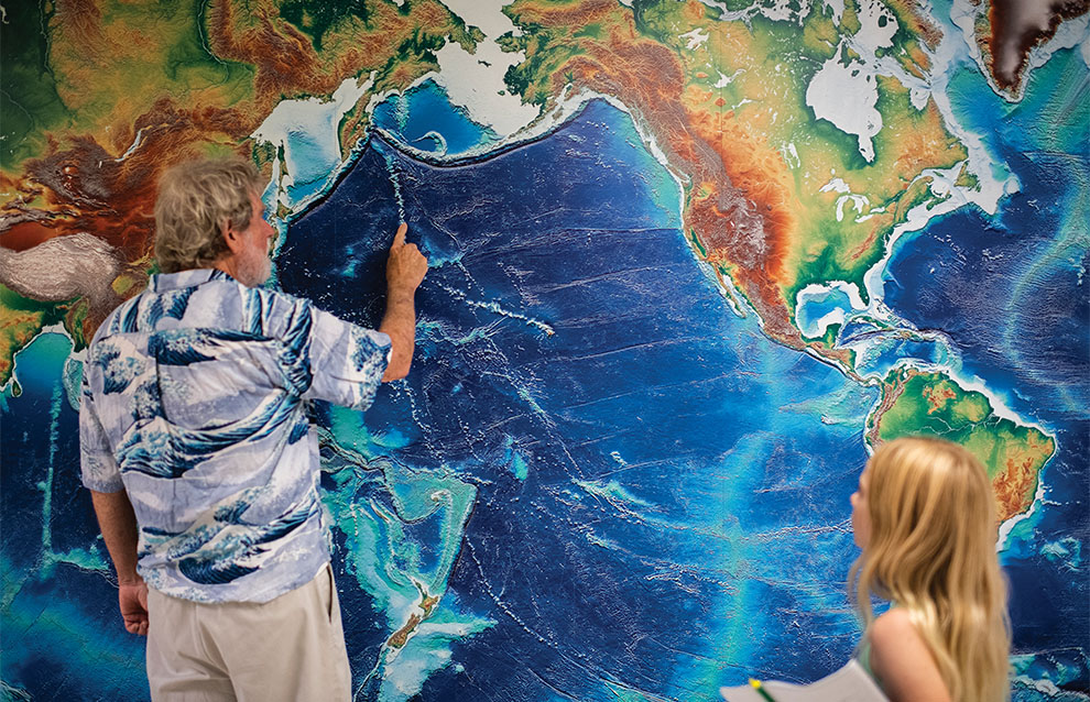 a person pointing at a map